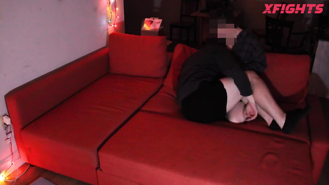 Hot ballbusting squeeze on the sofa