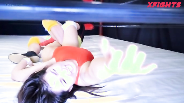 Akibacom - FGV-75 - A cute Asian girl wrestles a guy hard in the ring