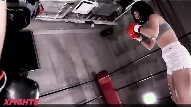 Akibacom - KOD-02 - Charming Asian girl beats up a guy in a boxing match.