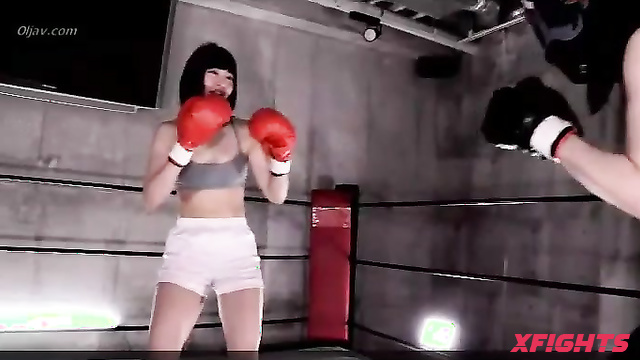 Akibacom - KOD-02 - Charming Asian girl beats up a guy in a boxing match.