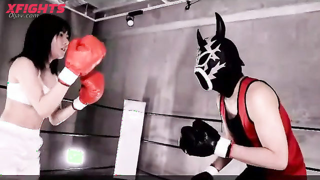 Akibacom - KOD-02 - Charming Asian girl beats up a guy in a boxing match.