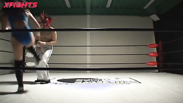 Akibacom - SRX-01 - Asian girl engaged in hardcore wrestling with a guy in the ring