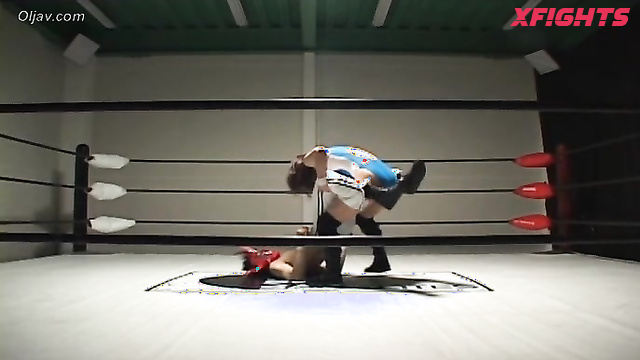 Akibacom - SRX-01 - Asian girl engaged in hardcore wrestling with a guy in the ring