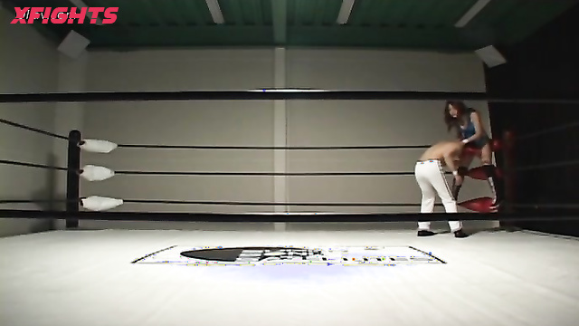 Akibacom - SRX-01 - Asian girl engaged in hardcore wrestling with a guy in the ring