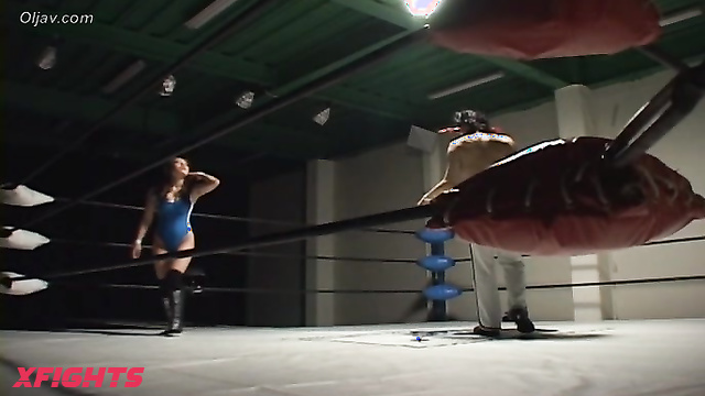 Akibacom - SRX-01 - Asian girl engaged in hardcore wrestling with a guy in the ring