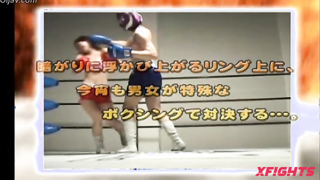 Akibacom - SRX-01 - Asian girl engaged in hardcore wrestling with a guy in the ring