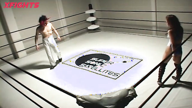 Akibacom - SRX-01 - Asian girl engaged in hardcore wrestling with a guy in the ring