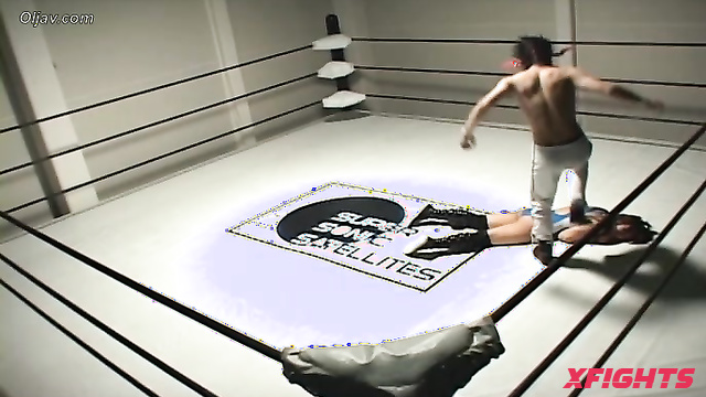 Akibacom - SRX-01 - Asian girl engaged in hardcore wrestling with a guy in the ring