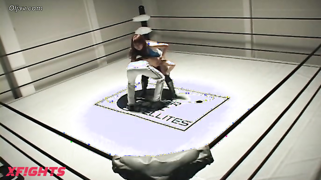 Akibacom - SRX-01 - Asian girl engaged in hardcore wrestling with a guy in the ring