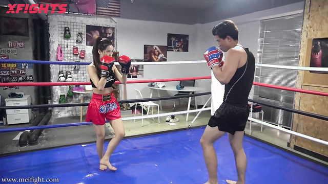 MEI Fight - MF-MB29 - Skinny Asian girl engaged in brutal boxing with a guy in the ring