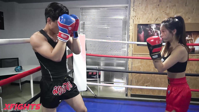 MEI Fight - MF-MB29 - Skinny Asian girl engaged in brutal boxing with a guy in the ring