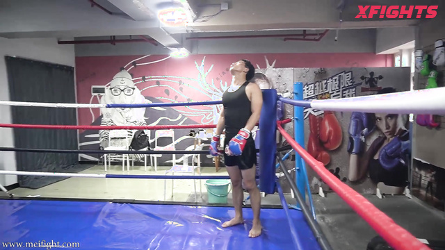 MEI Fight - MF-MB29 - Skinny Asian girl engaged in brutal boxing with a guy in the ring