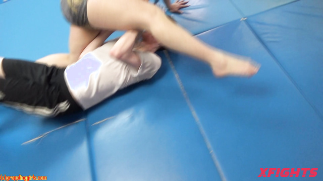 Grappling Girls in Action - GGCurvy201 - Girl harshly dominates guys in wrestling