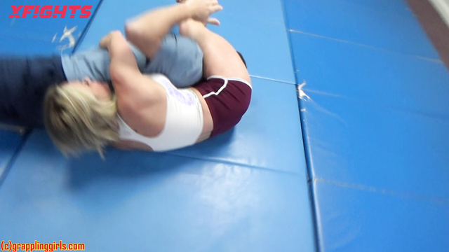 Grappling Girls in Action - Sexy blonde dominates a guy harshly