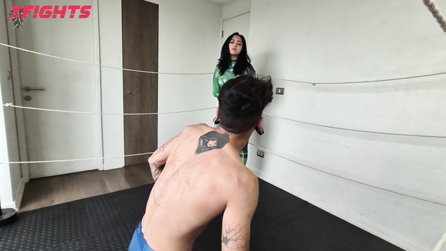 Fetish Machine Femme - The giantess shrinks her opponent in the ring