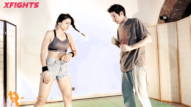 Fightingdream Video Store - Nataly & Marco - Brunette shows a guy some fighting techniques
