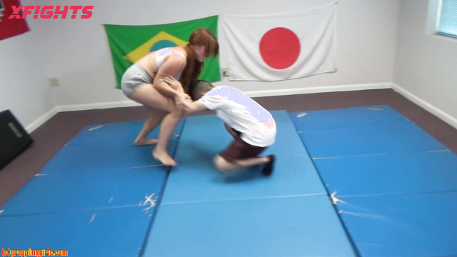 Grappling Girls in Action - Redhead strong girl harshly dominates a guy
