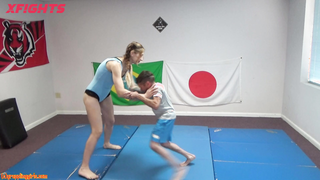 Grappling Girls In Action - Tall skinny girl dominates short guys