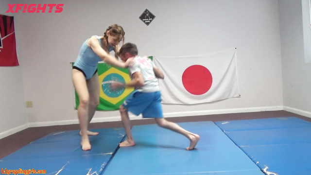 Grappling Girls In Action - Tall skinny girl dominates short guys